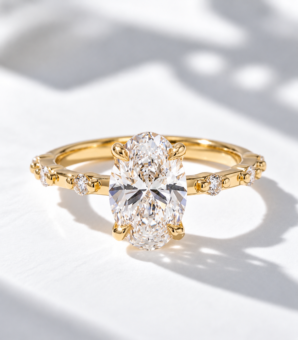 The Lumière, 3ct oval lab grown diamond engagement ring with accented band in 9k yellow gold