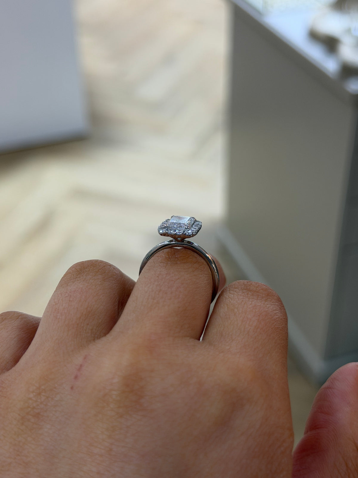 The Opulence 2ct emerald cut lab diamond ring in platinum, side view on the hand