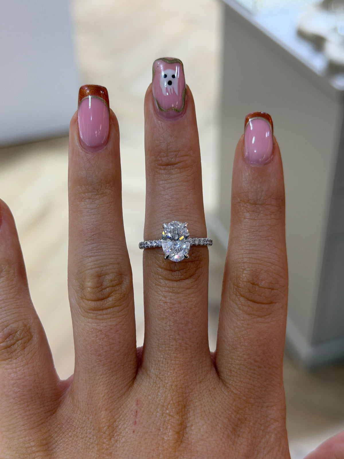 The Seren oval lab diamond pave ring, worn on the hand