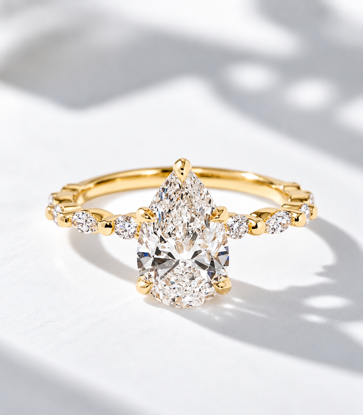 The Tear Drop, 2.5ct pear shape lab grown diamond engagement ring with accented band in 9k yellow gold