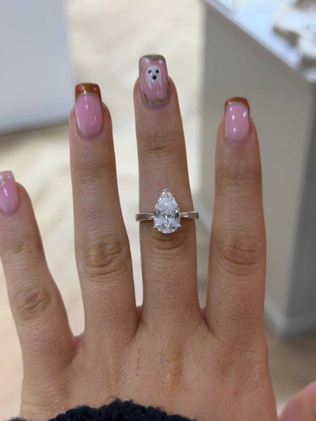 The Adeline 3ct pear lab diamond solitaire ring, worn on the hand
