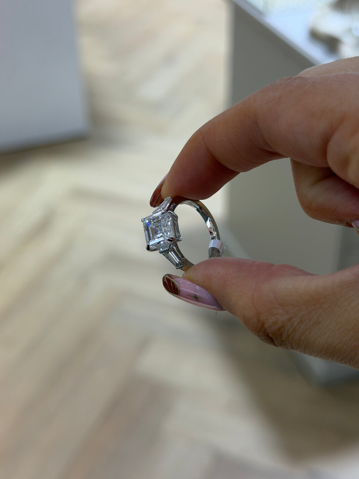 The Vivienne Asscher cut lab grown diamond engagement ring with tapered baguettes, platinum