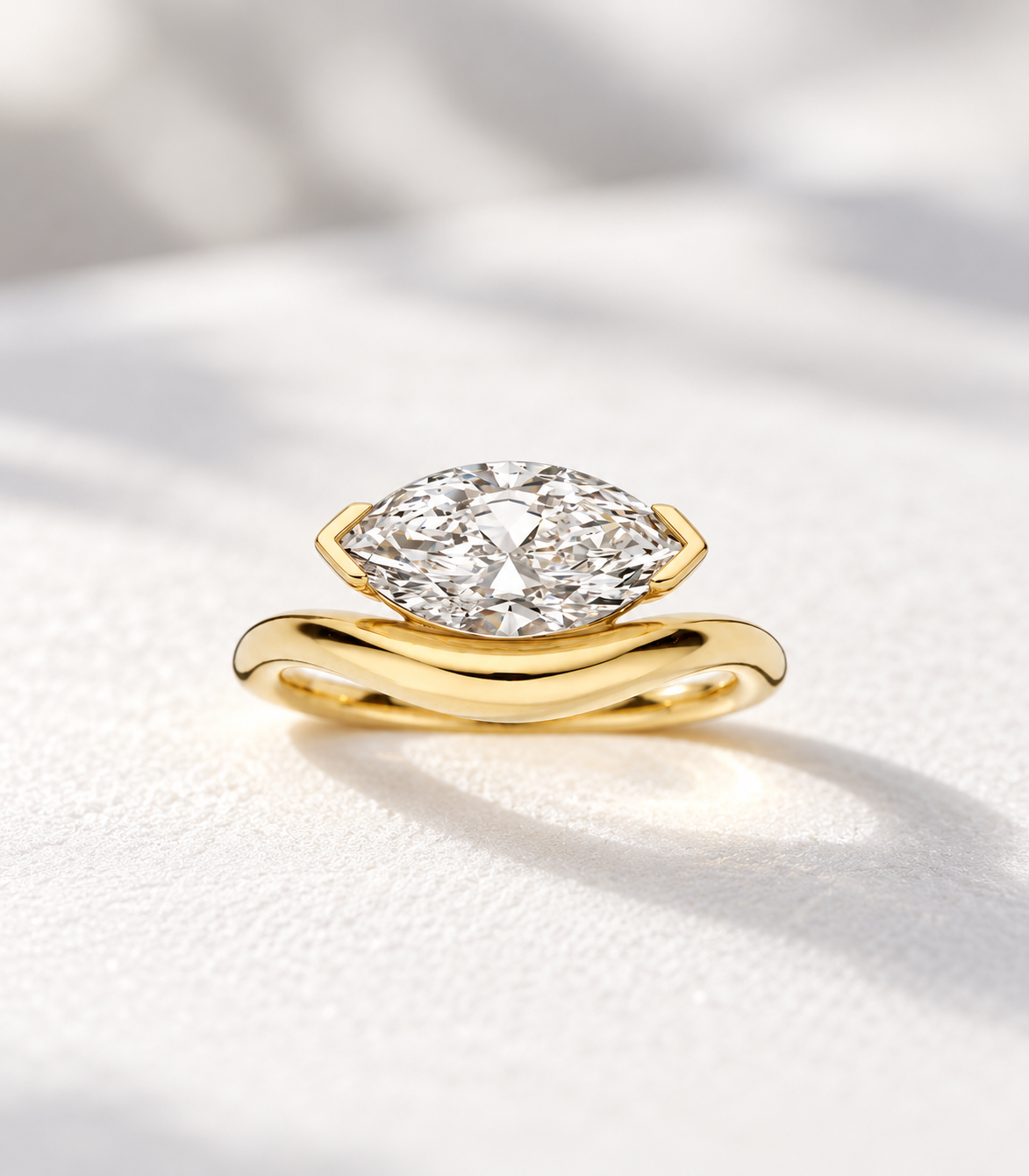 The Solstice, 2ct marquise cut lab grown diamond set east-west on a wave band in 9k yellow gold