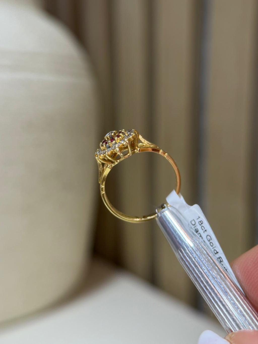 Ruby, diamond and gold cluster ring showing back setting