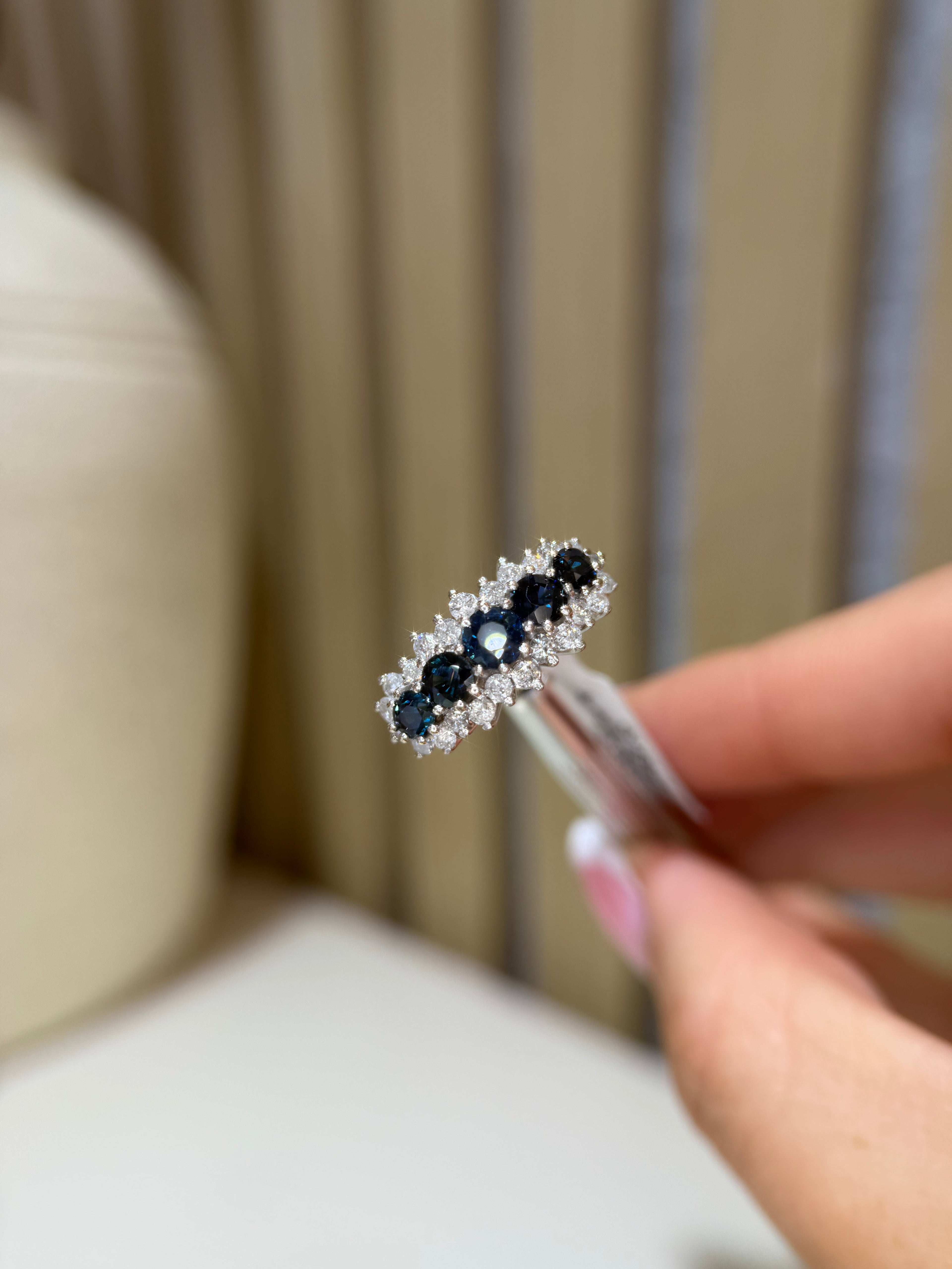 Sapphire diamond five-stone ring close-up