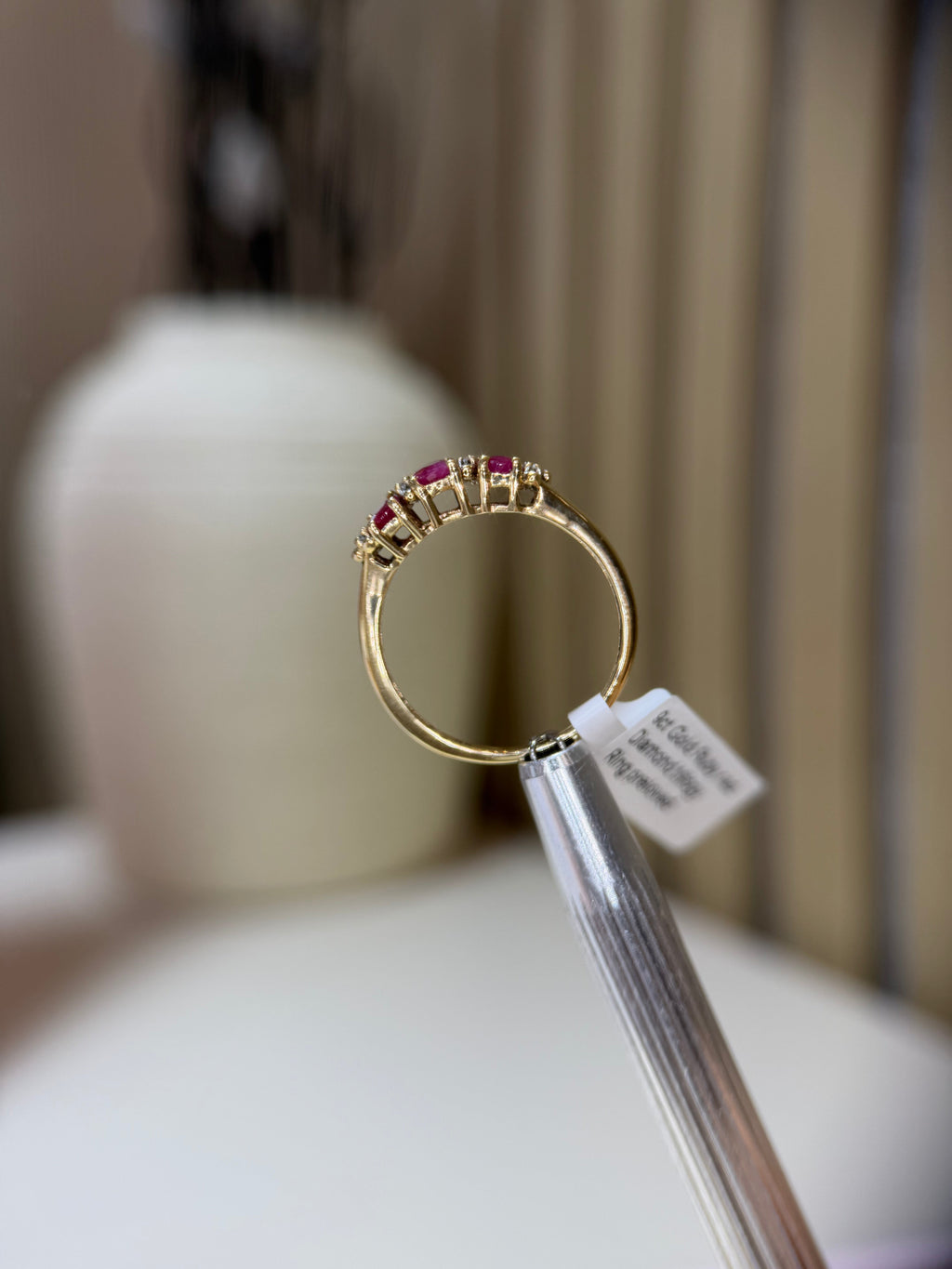 Ruby diamond trilogy ring close-up