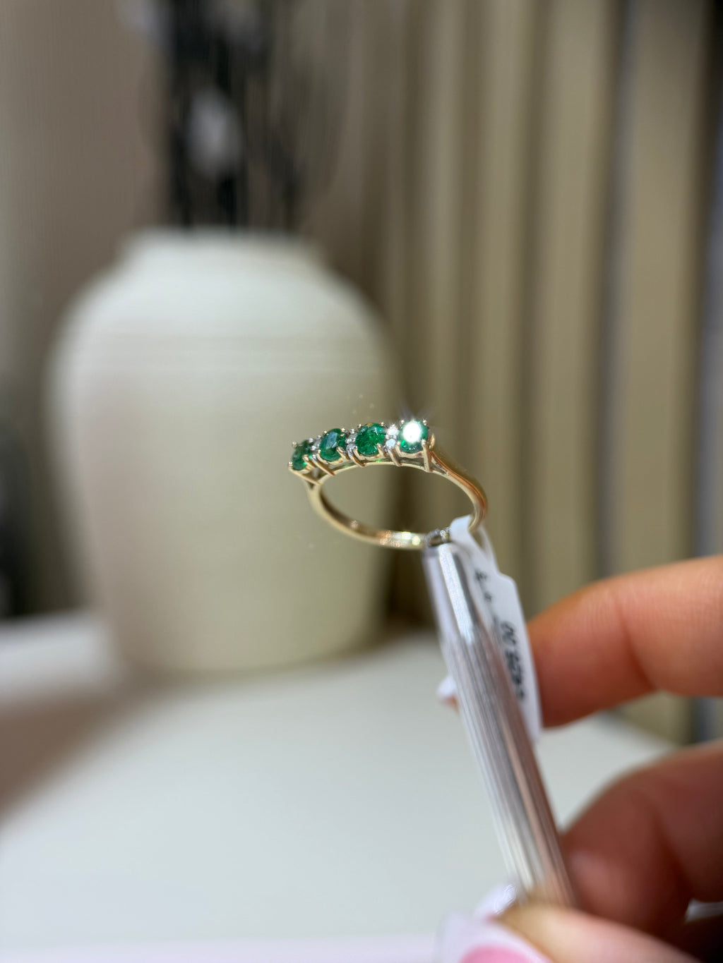 Emerald diamond eternity ring close-up