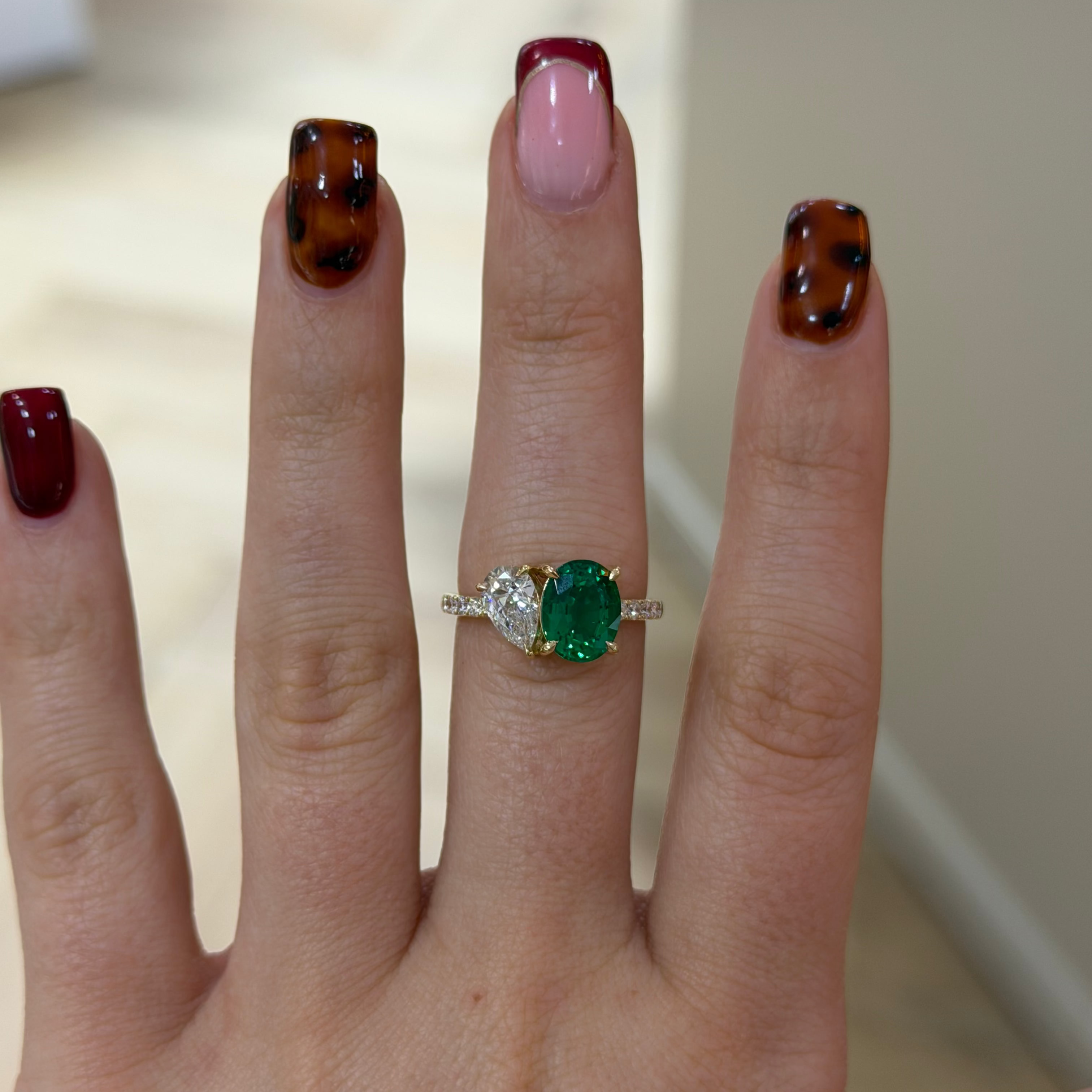 The Eden Ring emerald and pear diamond toi et moi engagement ring, 9k yellow gold, alternate view