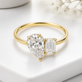 The Cleo Ring, pear and emerald cut lab grown diamond toi et moi ring in 9k yellow gold