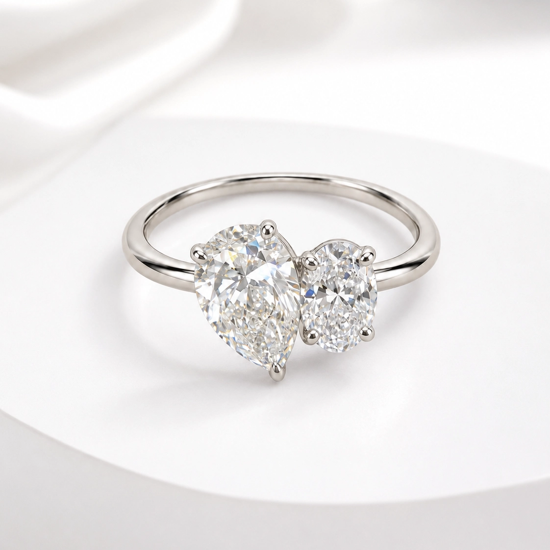 The Starlight Ring, pear and oval lab grown diamond toi et moi ring in 9k white gold
