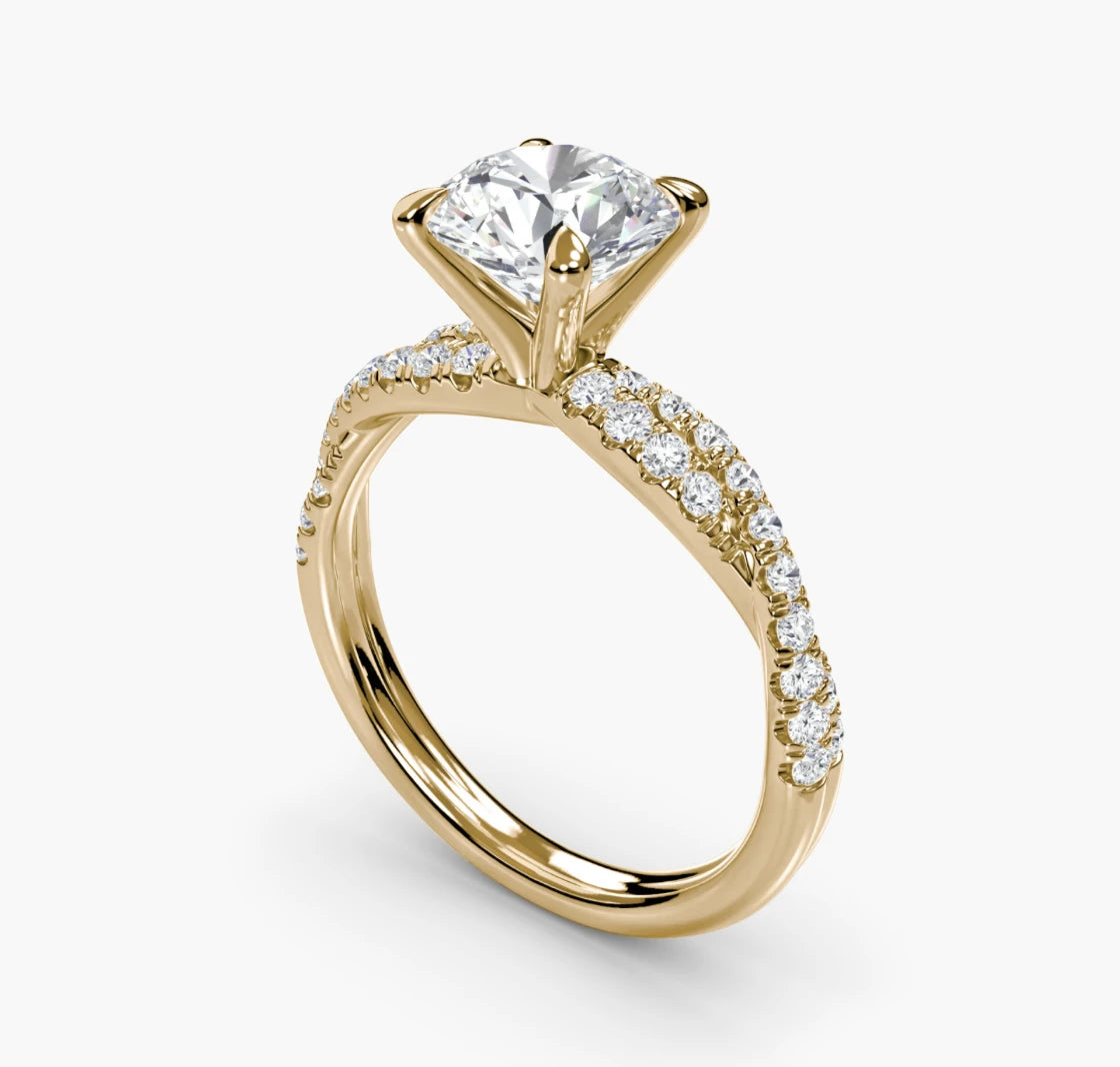Round brilliant diamond engagement ring with pavé twist band in yellow gold
